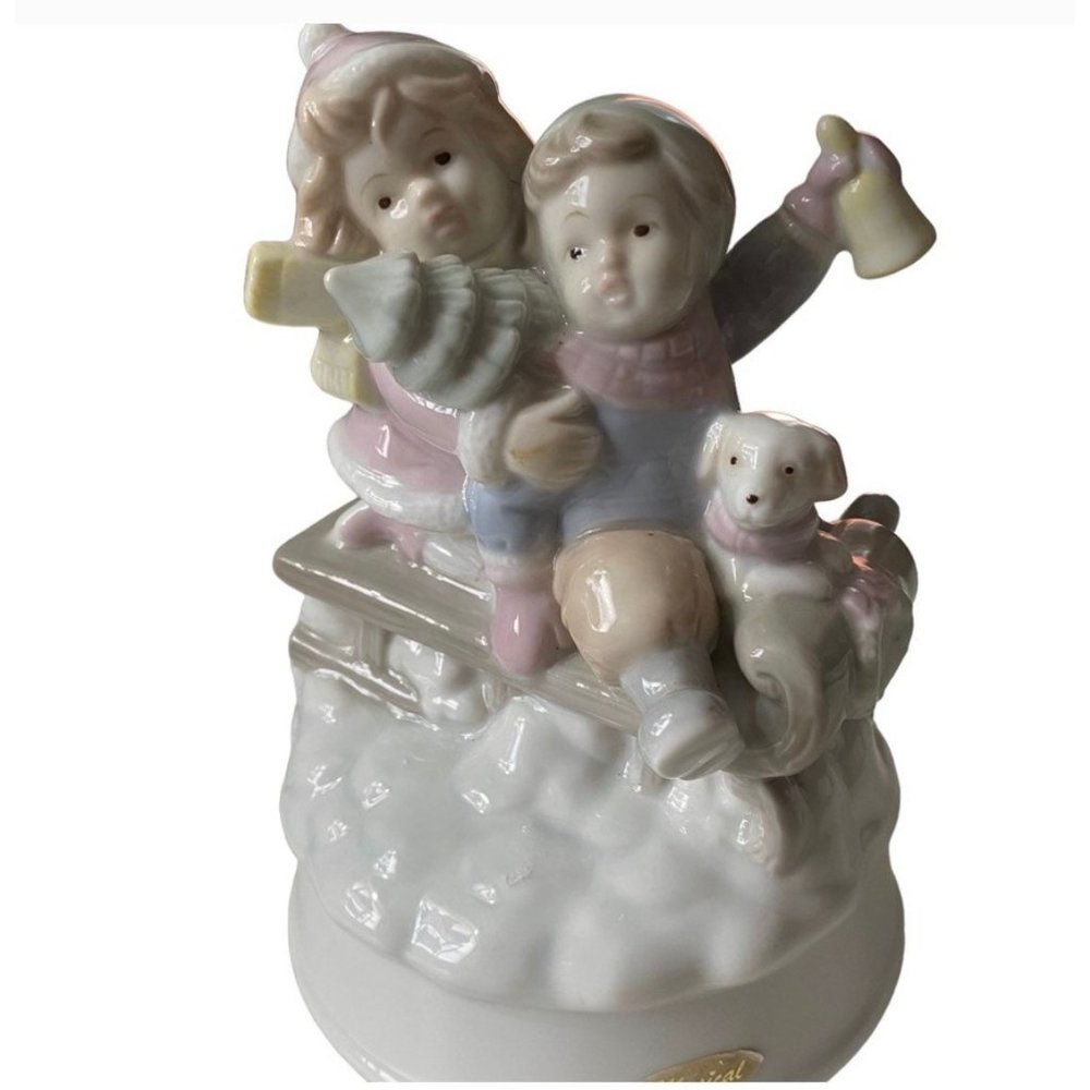 Let It Snow” Summit Collection Musical Rotating Ceramic Christmas Sledding